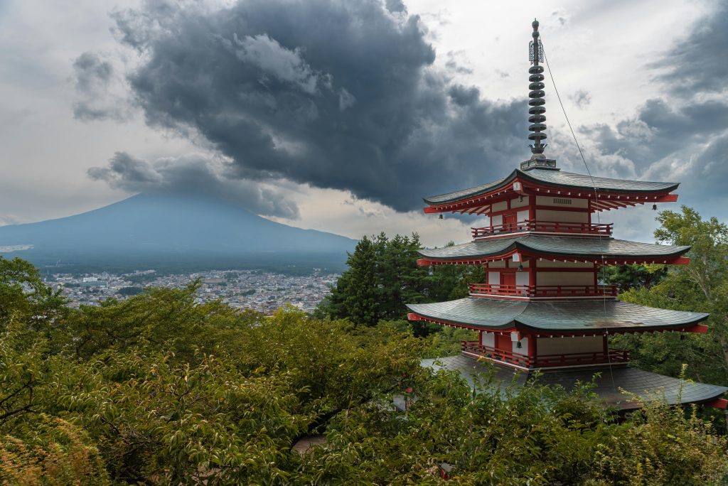 Chureito Pagoda overlooks Mount Fuji under dramatic skies.